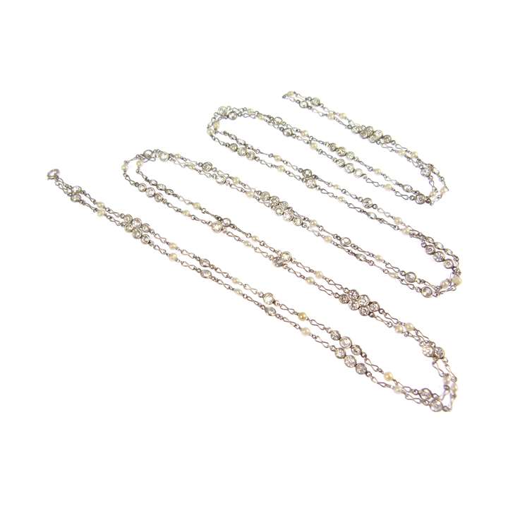 Early 20th century pearl and diamond long chain necklace